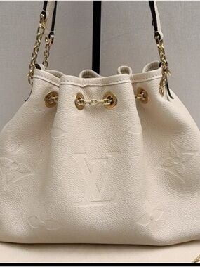 Louis Vuitton Cream Embossed Drawstring Shoulder Bag with Gold Hardware